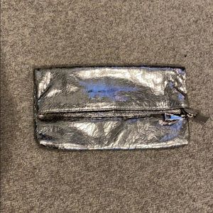 Silver Steve Madden folding clutch